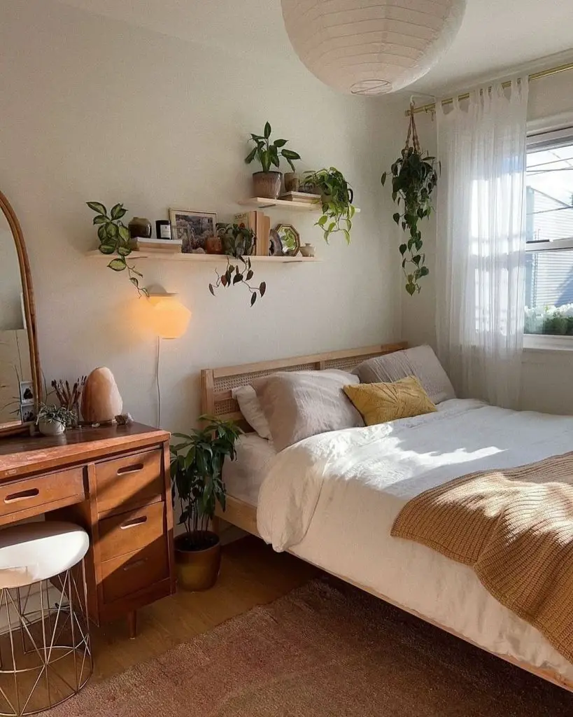 Minimalist bedroom with rattan mirror dresser and floating plant shelf